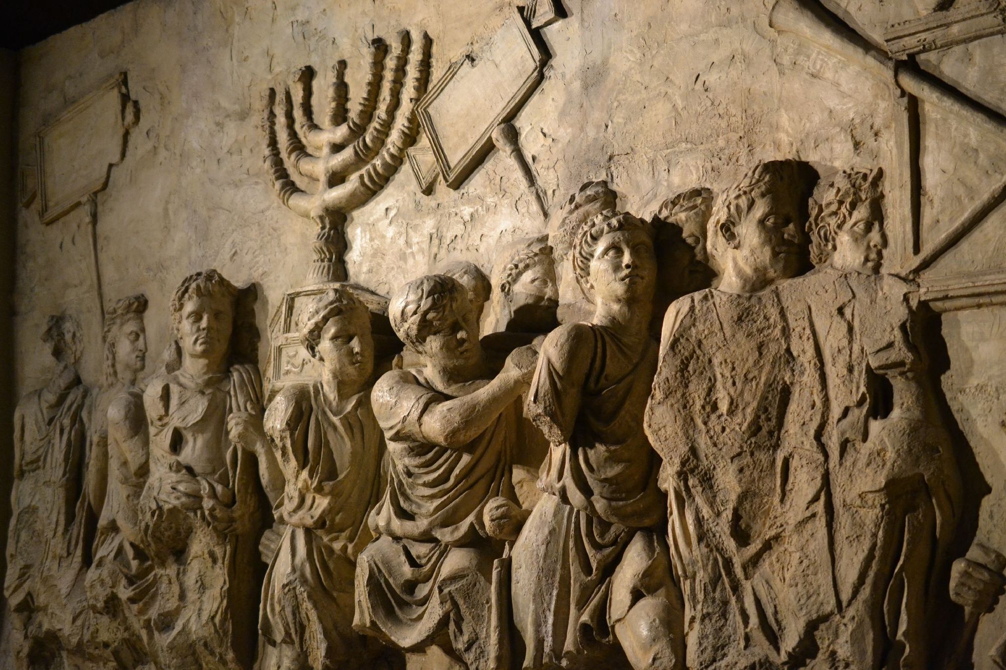 Carving on Arch of Titus depicting the taking of the Menorah from the Jewish Temple in 70 AD